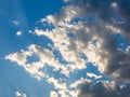 Blue sky with white clouds and some dark clouds approaching. Royalty Free Stock Photo