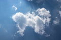 Blue sky with white clouds and sunbeams