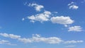 blue sky with white clouds on sunny day, suitable for background or sky substitution