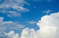 Blue sky in white cumulus clouds. Beautiful peaceful sky with large white and gray storm clouds. Summer sunny day. Good weather. Royalty Free Stock Photo