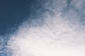 Blue sky with white fluffy clouds, beautiful dark heaven, light and soft cumulus in deep skies outdoors Royalty Free Stock Photo