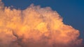 Blue sky and white fluffy clouds on sunset sky. White cumulus clouds. Dramatic sky and clouds abstract background. Warm weather