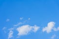 Blue sky with white fluffy clouds texture. High in the sky flies copter, drone, quadrocopter. For modern background Royalty Free Stock Photo