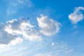 Blue sky with white fluffy clouds and two birds flying in the sky. Royalty Free Stock Photo