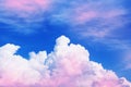 Blue sky with white and pink clouds on a Sunny summer day. Royalty Free Stock Photo