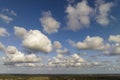 Blue sky with white summer rain clouds. Colorful summer landscape Royalty Free Stock Photo