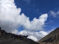 Blue sky, white thick cloud, mountain, horses and climbers