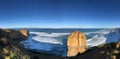 Blue sky, white waves, rocks composed of the coast,