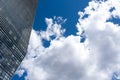 Blue skyscraper with reflections of clouds on windows Royalty Free Stock Photo