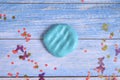 Blue slime clod on blue wooden background