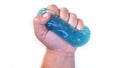 The child crushes the blue slime in his hand