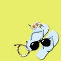 Blue slippers, sunglasses, bracelet and daisies on a yellow background. Summer decor and beach amenities for decoration.