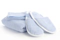 Blue slippers, towel and bath & shower mitt