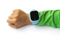 Blue smart digital watch on boy hand with green sleeve. Modern children technologies. GPS tracker for kids, child tracking and Royalty Free Stock Photo