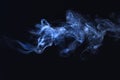 Blue smoke on black background, freeze motion of powder explosion