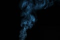 Blue smoke from incense on a black background Royalty Free Stock Photo