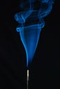 Blue smoke incense stick on black background Royalty Free Stock Photo