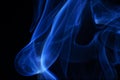 Blue smoke over black background. Royalty Free Stock Photo