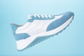 Blue sneaker blue background