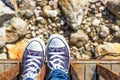 Blue sneakers on the beach Royalty Free Stock Photo