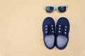 Blue sneakers and sunglasses. Summer holidays Royalty Free Stock Photo