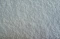 Blue snow Christmas background. Sparkling whiteness texture. Winter abstract background. Clean pristine first snow.