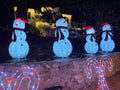 Blue Snowman at Night With Candy Canes