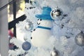 Blue snowman and white christmas tree 1