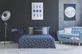 Blue sofa in bedroom interior