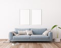 Blue sofa in modern living room design, frame mockup Royalty Free Stock Photo