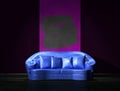 Blue sofa with purple part of the wall