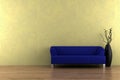 Blue sofa and vase in front of yellow wall