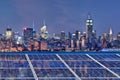 Blue Solar Cell Panels, New York Skyline Illuminated At Night