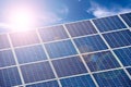 Blue solar cells, blue sky and sun Royalty Free Stock Photo