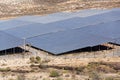 Blue solar panels at photovoltaics power station farm, future innovation energy concept, clear blue sky background