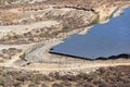 Blue solar panels at photovoltaics power station farm, future innovation energy concept, clear blue sky background