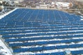 Blue solar photo voltaic panels system producing renewable clean energy in rural area in winter Royalty Free Stock Photo