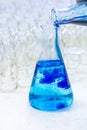 Blue solution methylene blue in erlenmeyer, experiments in chemistry laboratory