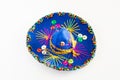 Blue sombrero with colorful ornaments on white background. Symbol of Mexico concept