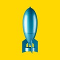 Blue spaceship or rocket isolated on a yellow background flying upward