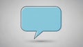 A blue speech bubble on a gray background with a subtle shadow effect Royalty Free Stock Photo