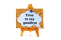 Blue speech bubble with phrase Time to Say Goodbay on corkboard