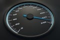 Blue speedometer in car on dashboard