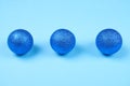 Blue spheres on pastel background