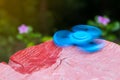 Blue spinner hand with red stump. Royalty Free Stock Photo