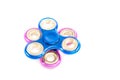 Blue spinning spinner on fixed pink Royalty Free Stock Photo