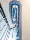 Blue Spiral Staircase Paris. Entrance in France with a cornflower blue staircase. Bottom view Royalty Free Stock Photo