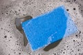 Blue Dish Sponge in Sink Royalty Free Stock Photo