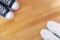 Blue sports sneakers on the background of a wooden floor. View from above. Royalty Free Stock Photo