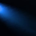 Blue spotlight on side corner, blue shaft of light on black background with grunge texture Royalty Free Stock Photo